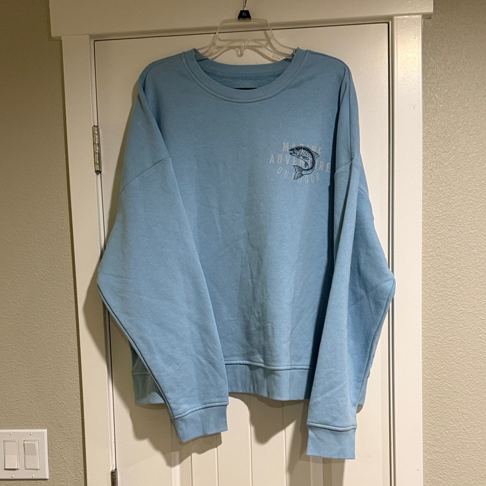 Original Use Light Blue Crewneck Sweatshirt with Small Chest Graphic